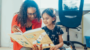 Adult and child reading Curious George book