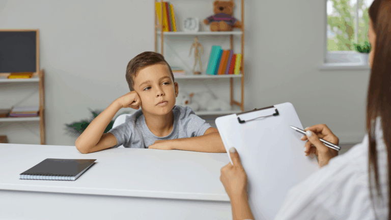 Woman with a clipboard interacting with a boy